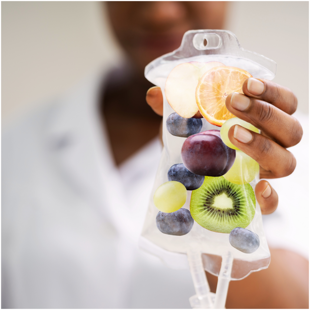 A person is holding a bag of fruit in their hand.