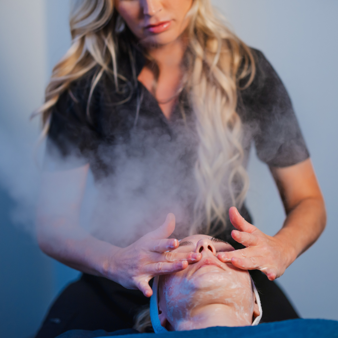 woman giving a facial to another woman