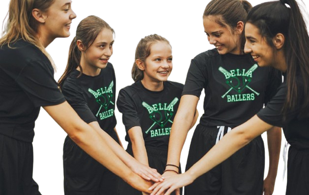 A group of girls wearing bella ballers shirts put their hands together