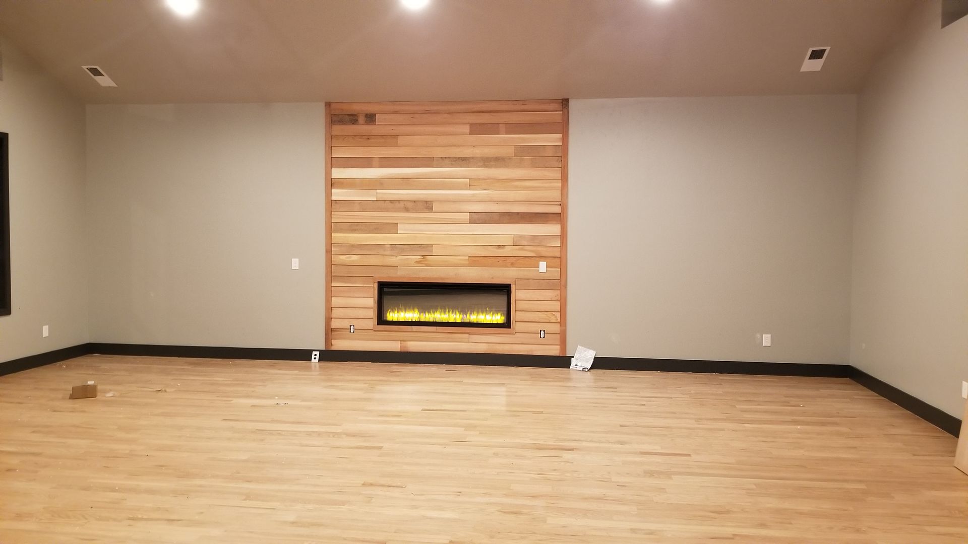There is a fireplace in the middle of the room.