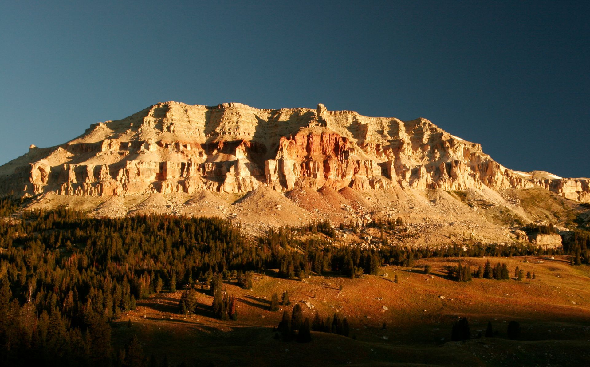 Jagged cliffs provide a stunning backdrop near the campground at Beartooth Lake, Wyoming.