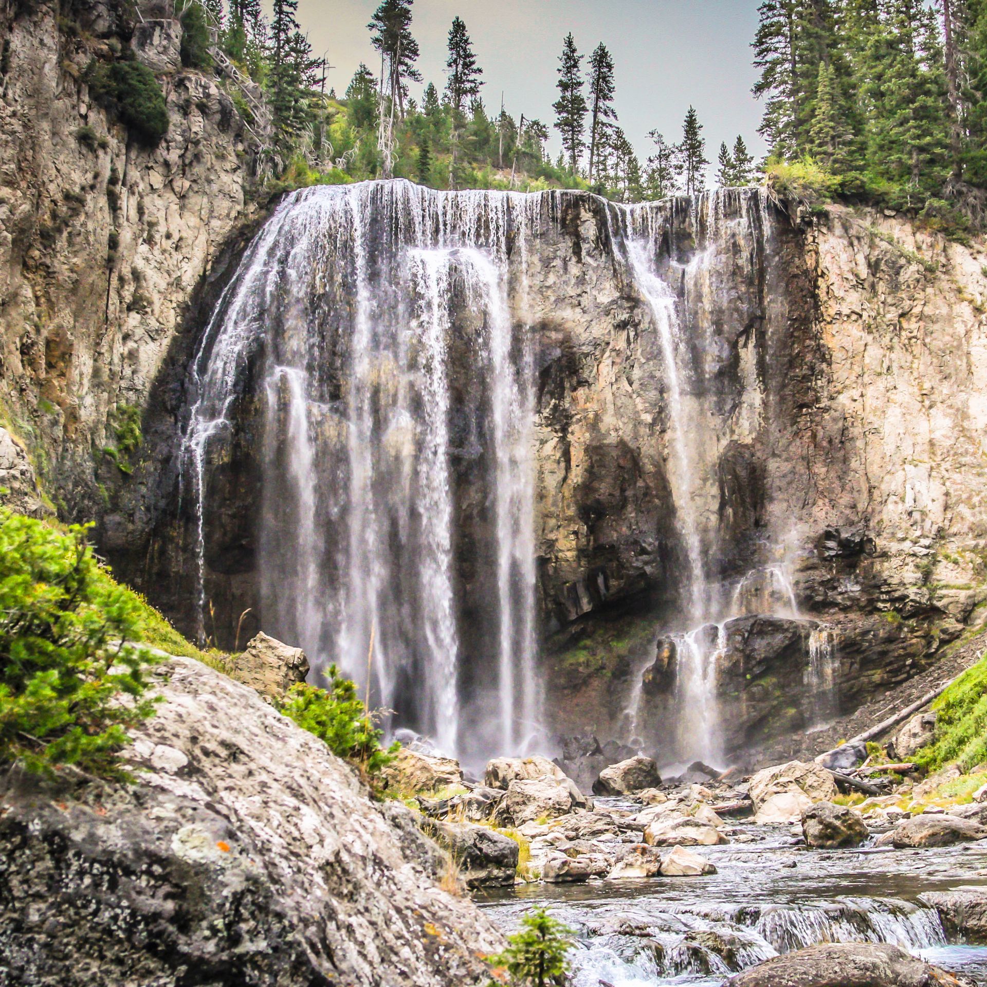 Beautiful and delicate strands of water cascade over Dunanda Falls along the Boundary Creek Trail in Yellowstone.