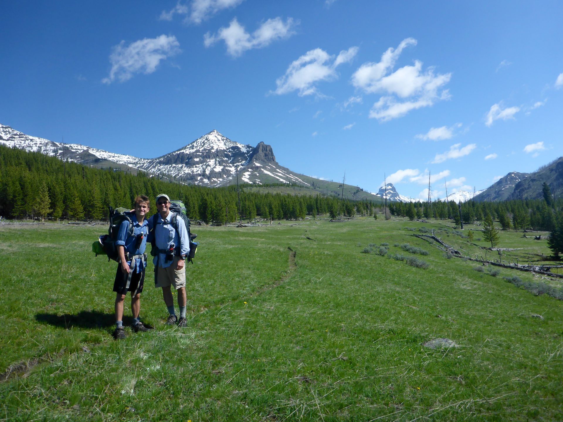 A father and son take a short break to capture the moment along the scenic Cache Creek Trail in Yellowstone National Park.