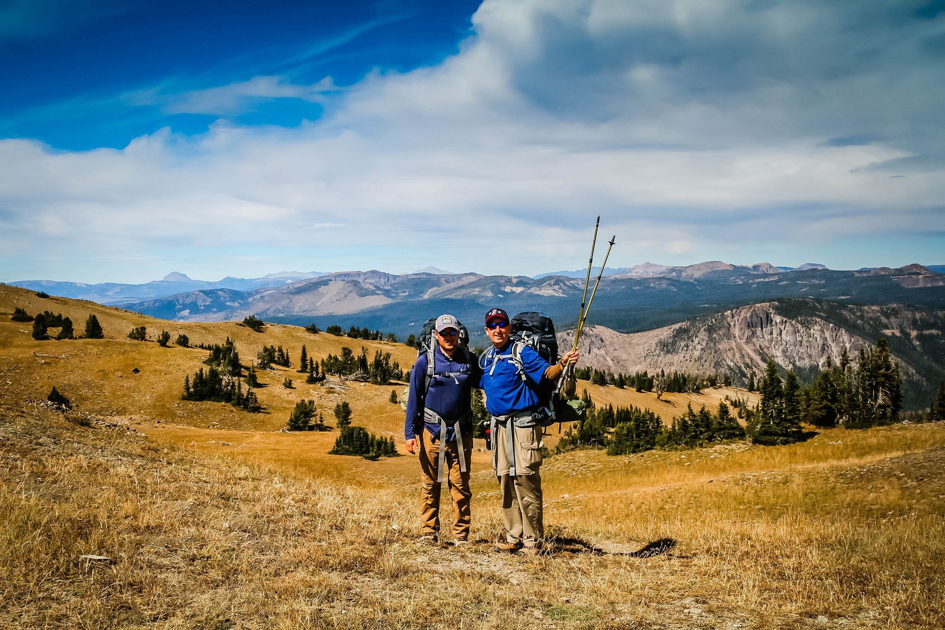 Backpackers celebrate after reaching the top of Electric Pass via the Sportsman Lake Trail in the scenic Gallatin Range.