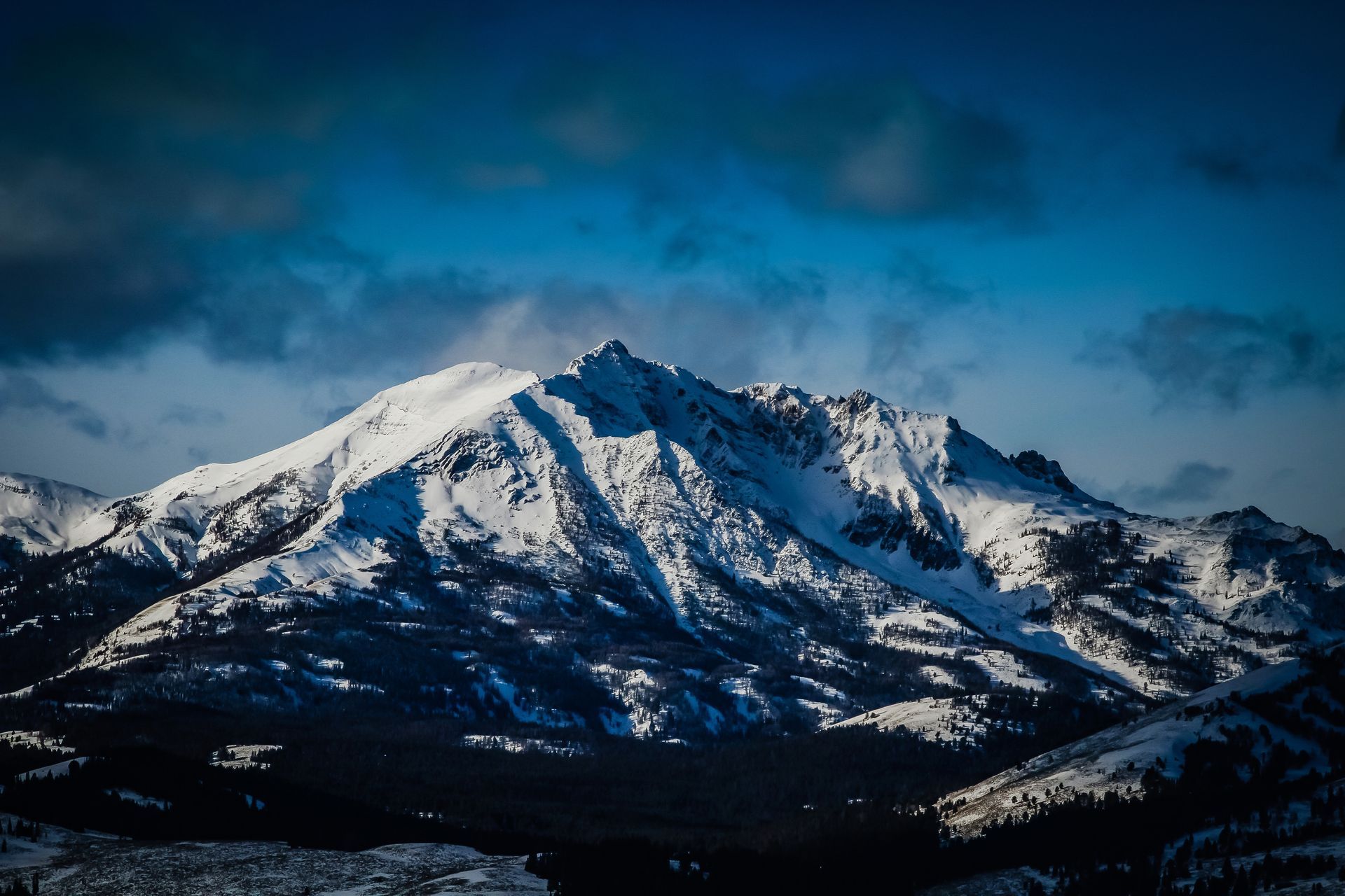 From the top of Bunsen Peak, the rugged and snow covered summit of Electric Peak rises to nearly 11,000 feet.