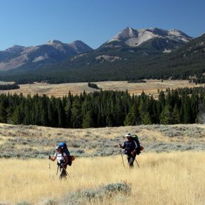 Backpackers admire the view of Electric Peaks rugged profile during a guided tour in Yellowstone.