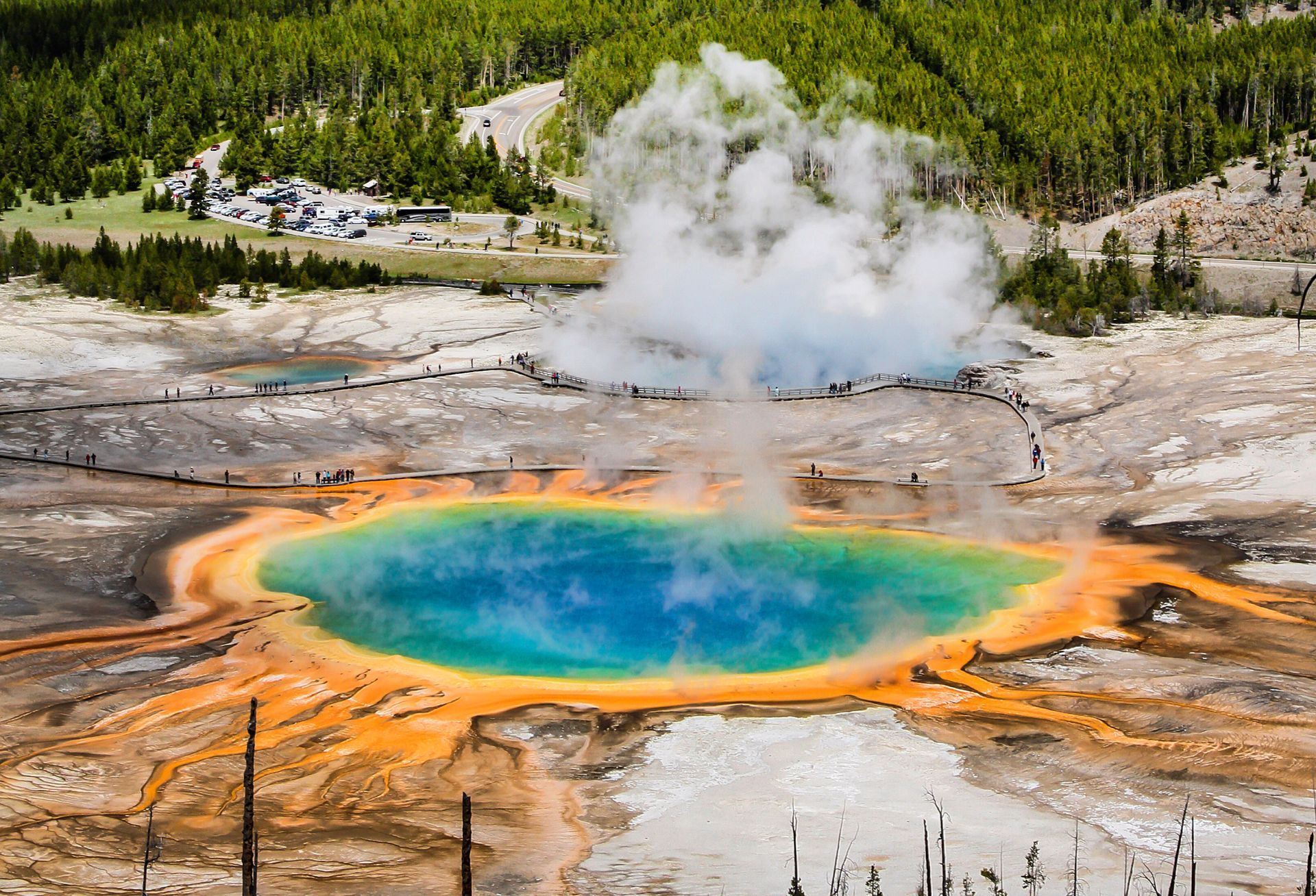 Backpackers form a perfect line as they traverse an open meadow along the Fairy Falls Trail.