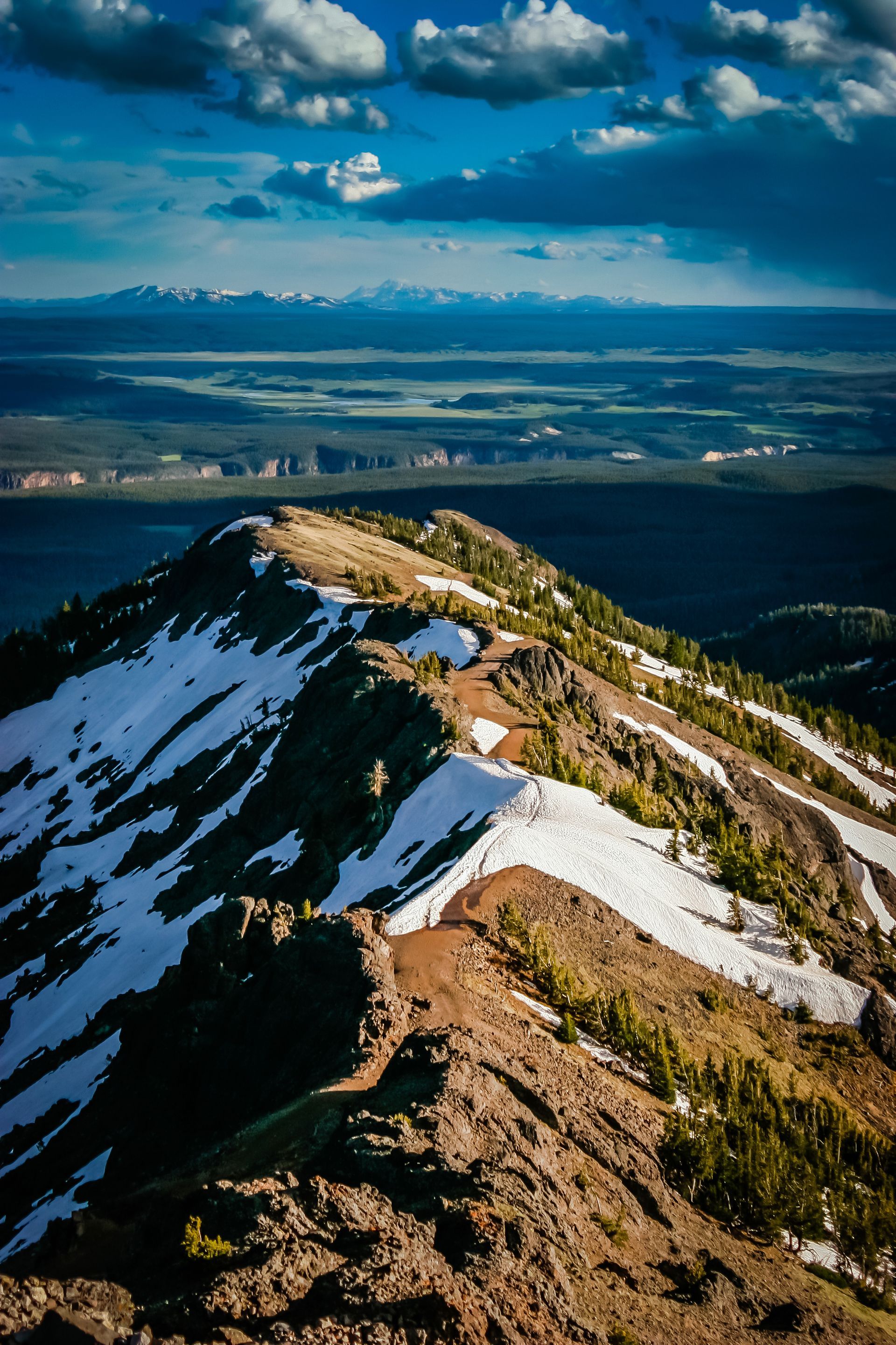From the top of Mount Washburn day hikers are rewarded with a spectacular view of Yellowstone that stretches as far south as the Grand Tetons.