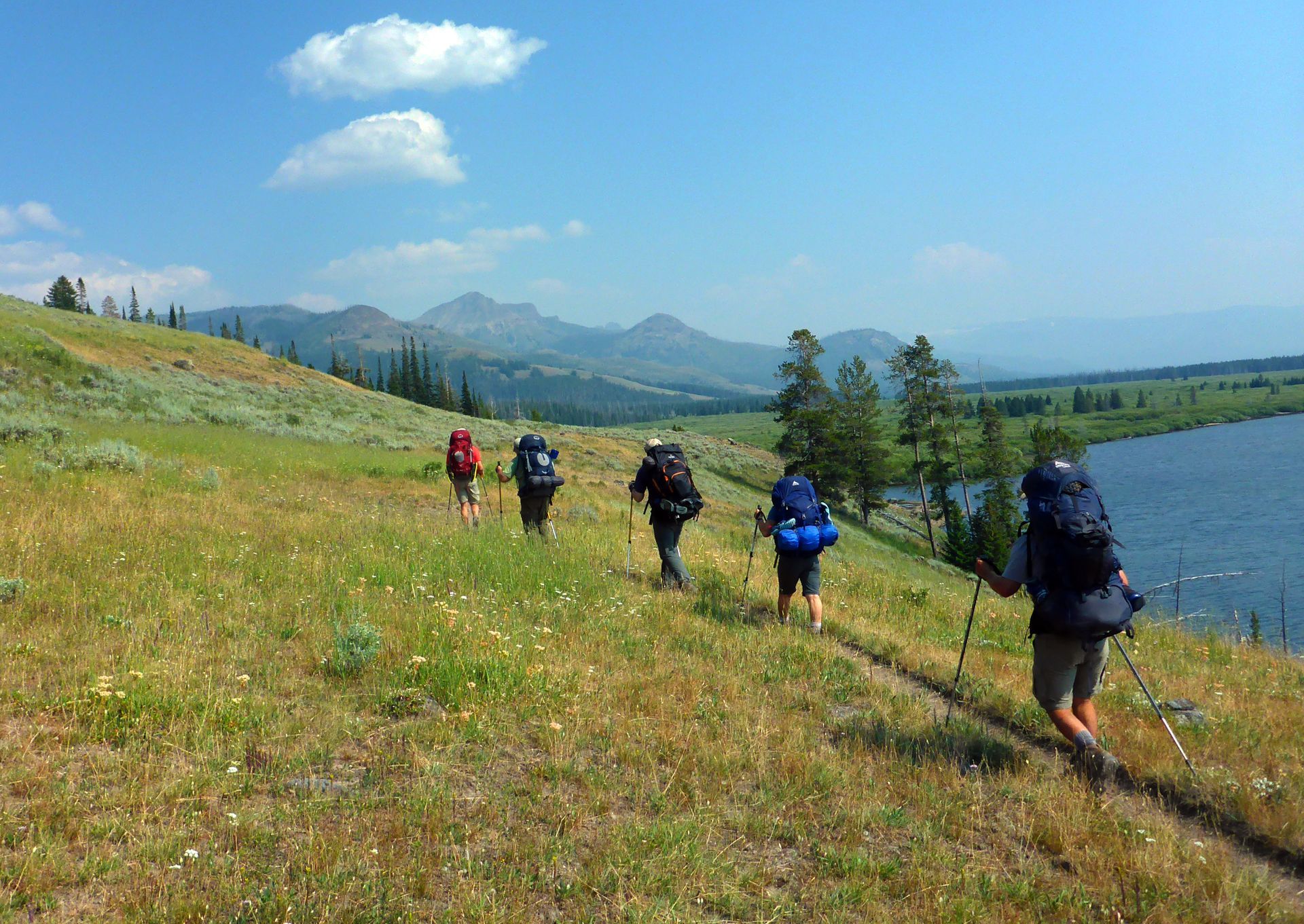 Backpackers skirt the eastern edge of Yellowstone Lake as they head deeper into the remote Thorofare region of Yellowstone.