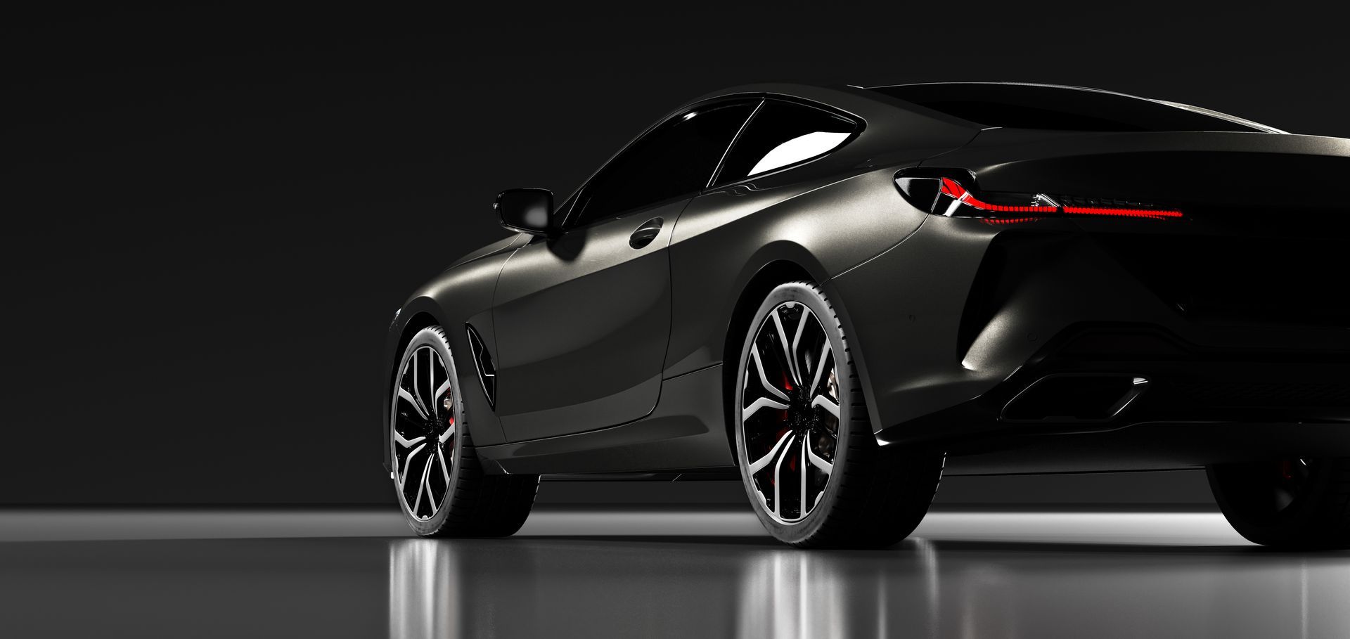 Sleek black sports coupe on a glossy studio floor, rear three-quarter view. | Cruz-N-Carz
