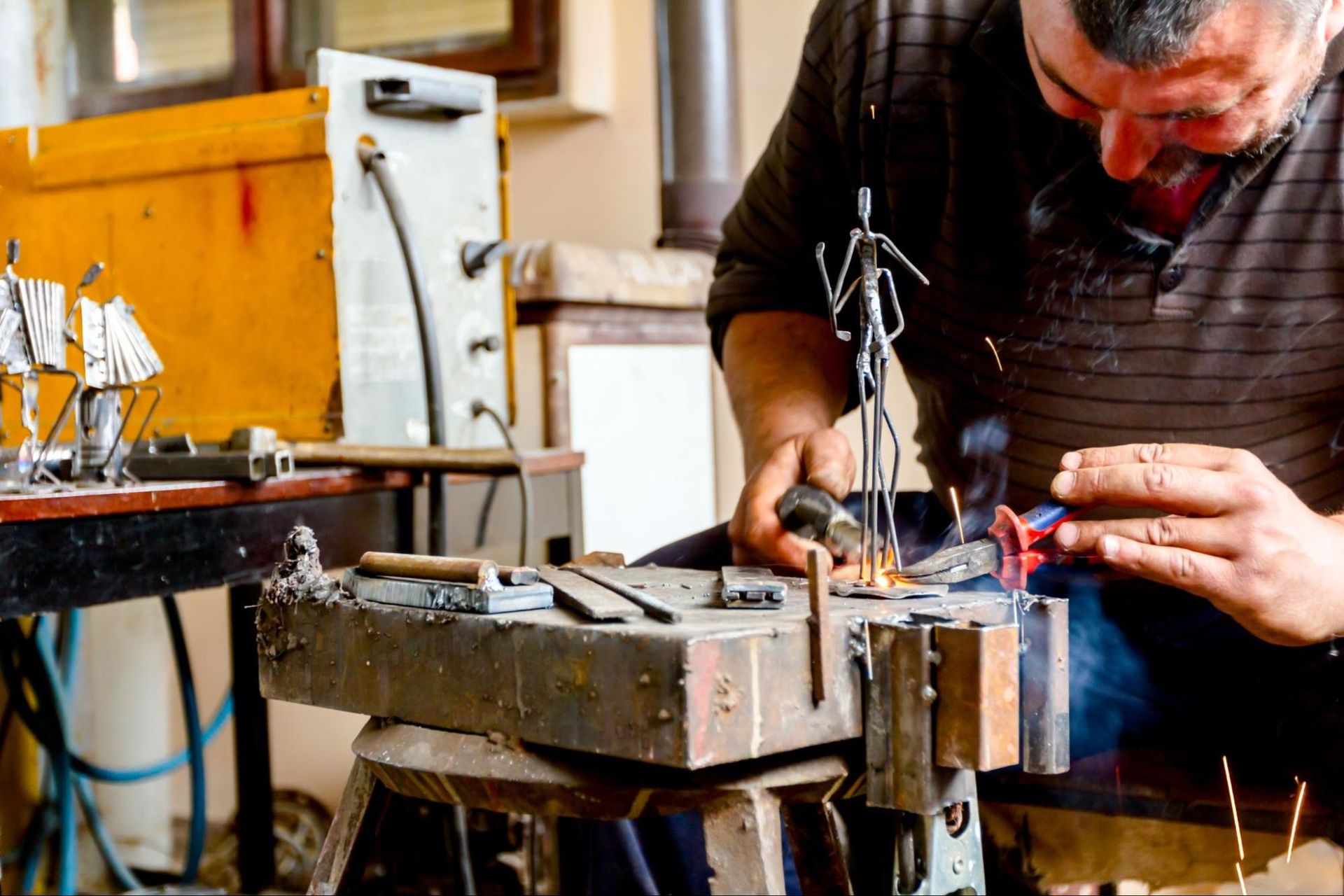 Artist Making Stainless Steel Sculpture