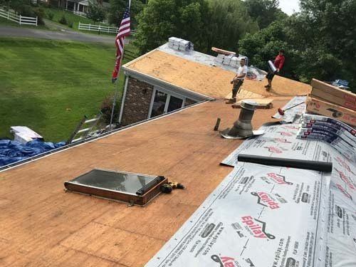 bare wood roof surface with skylight