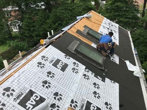 man working on roof