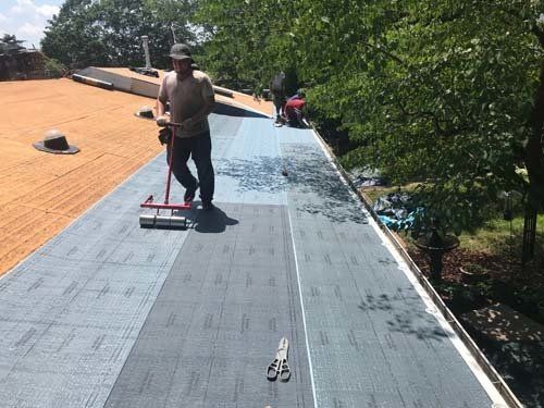man working on roof