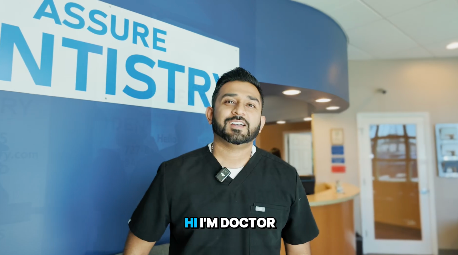 Doctor Maulin Patel in the office lobby smiling