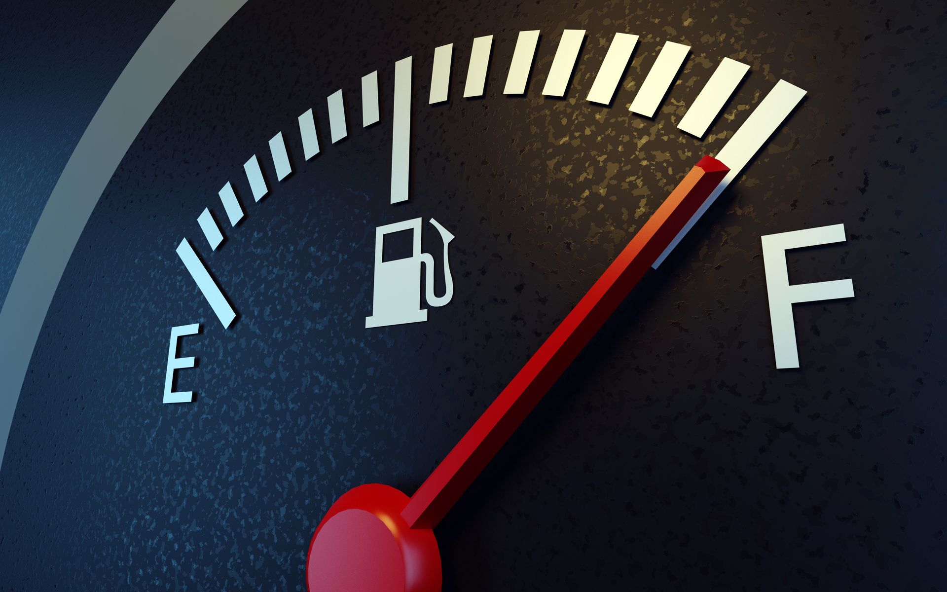 A car dashboard fuel gauge showing near full tank with red indicator needle.