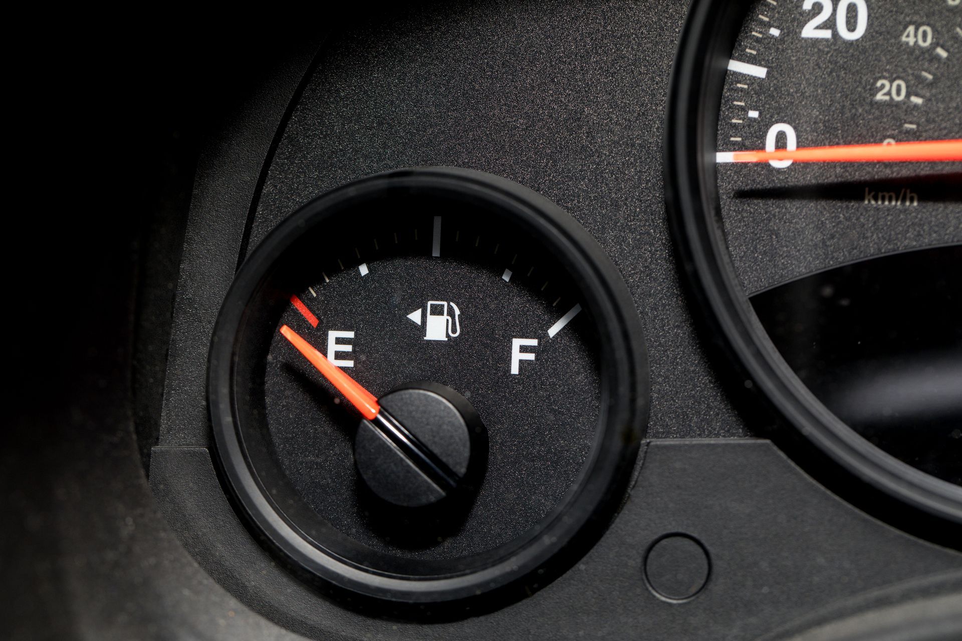 Low fuel guage shown in a car shot close Low fuel guage shown in a car shot close