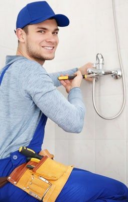 Plumber Fixing Faucet