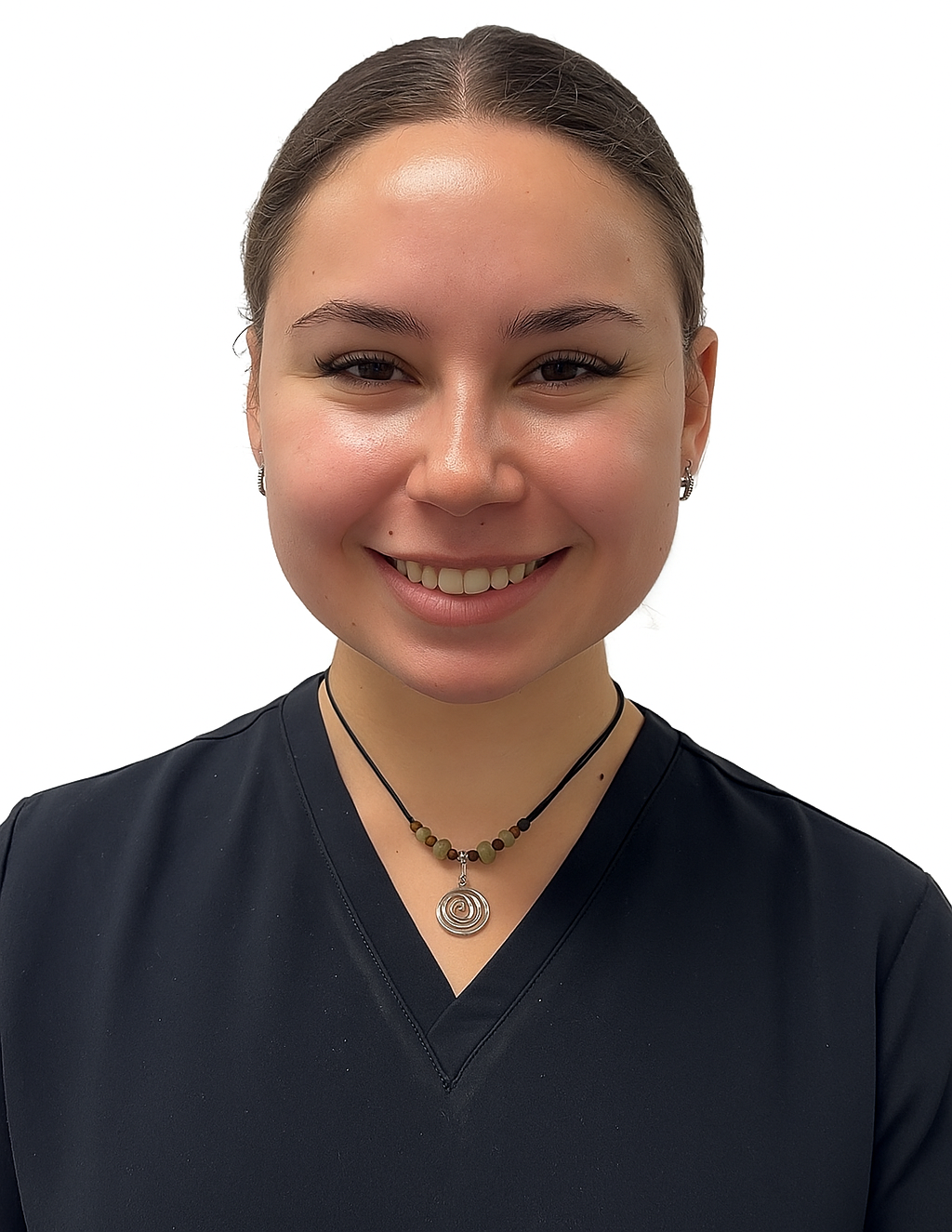 Smiling woman in a dark blue top and necklace, against a white background.