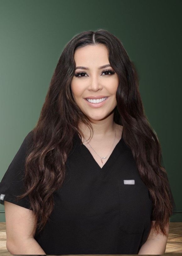 A woman in a black scrub top is smiling for the camera.
Daniela from Beyouty MedSpa