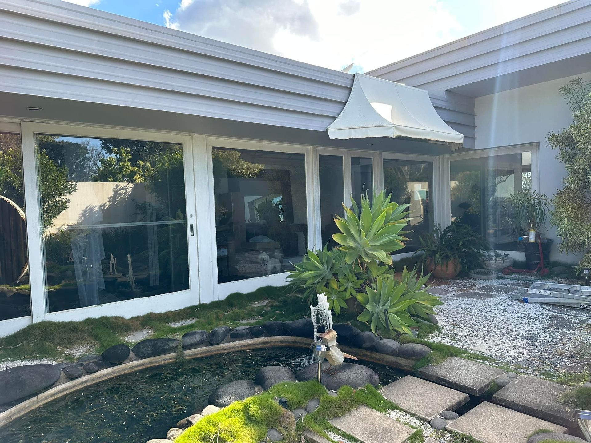 Exterior of a Modern Home With Large Windows — Wide Bay Tinting in Childers, QLD