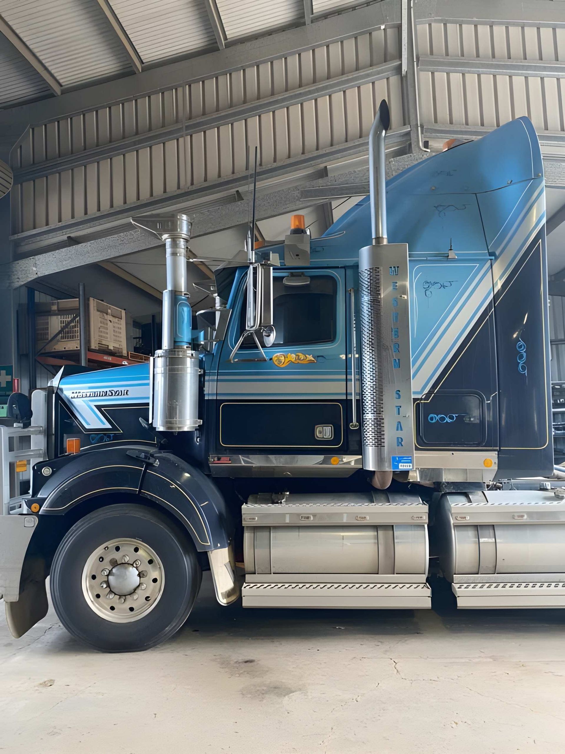 Blue and Black Semi-truck Parked Inside a Building — Wide Bay Tinting in Kensington, QLD