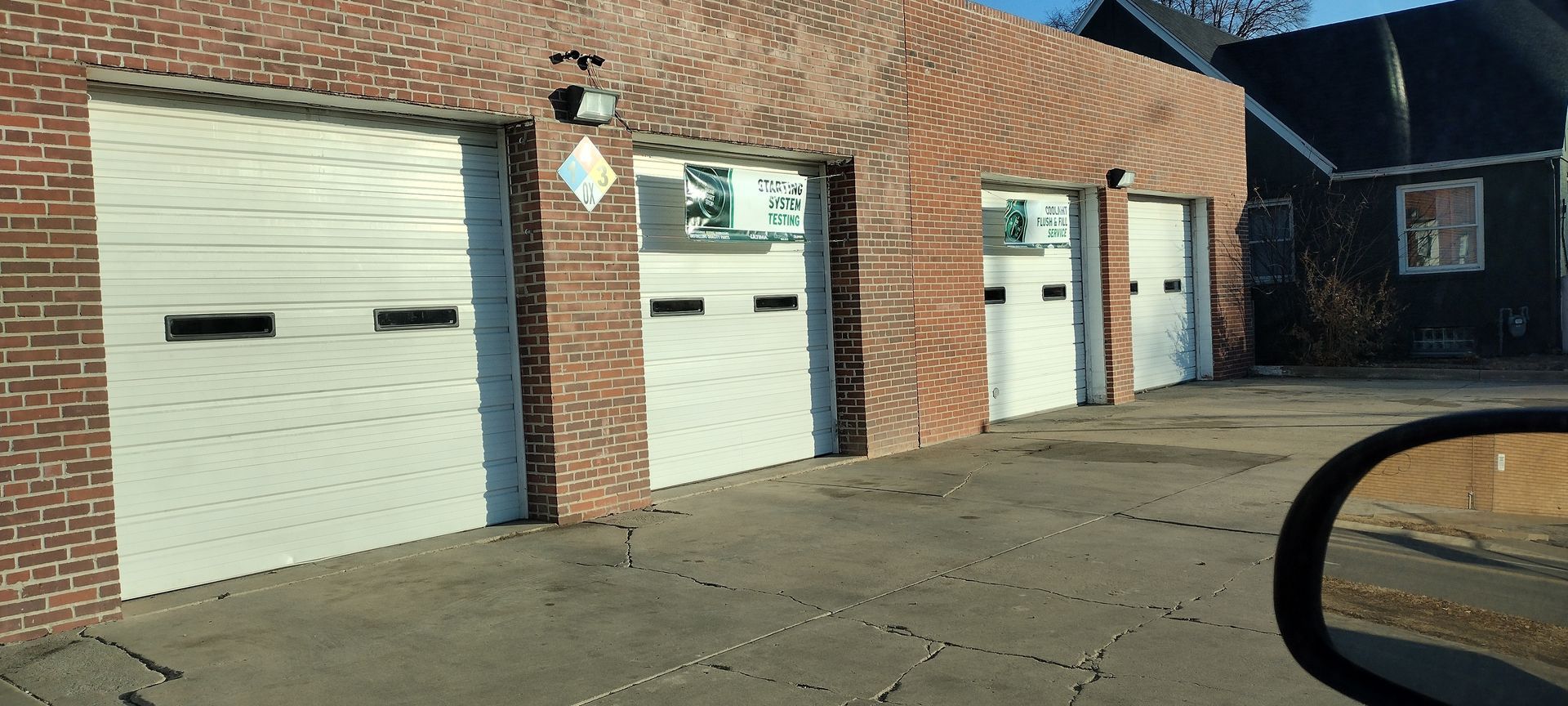 Brick garage with four bays | MJ Auto Repair