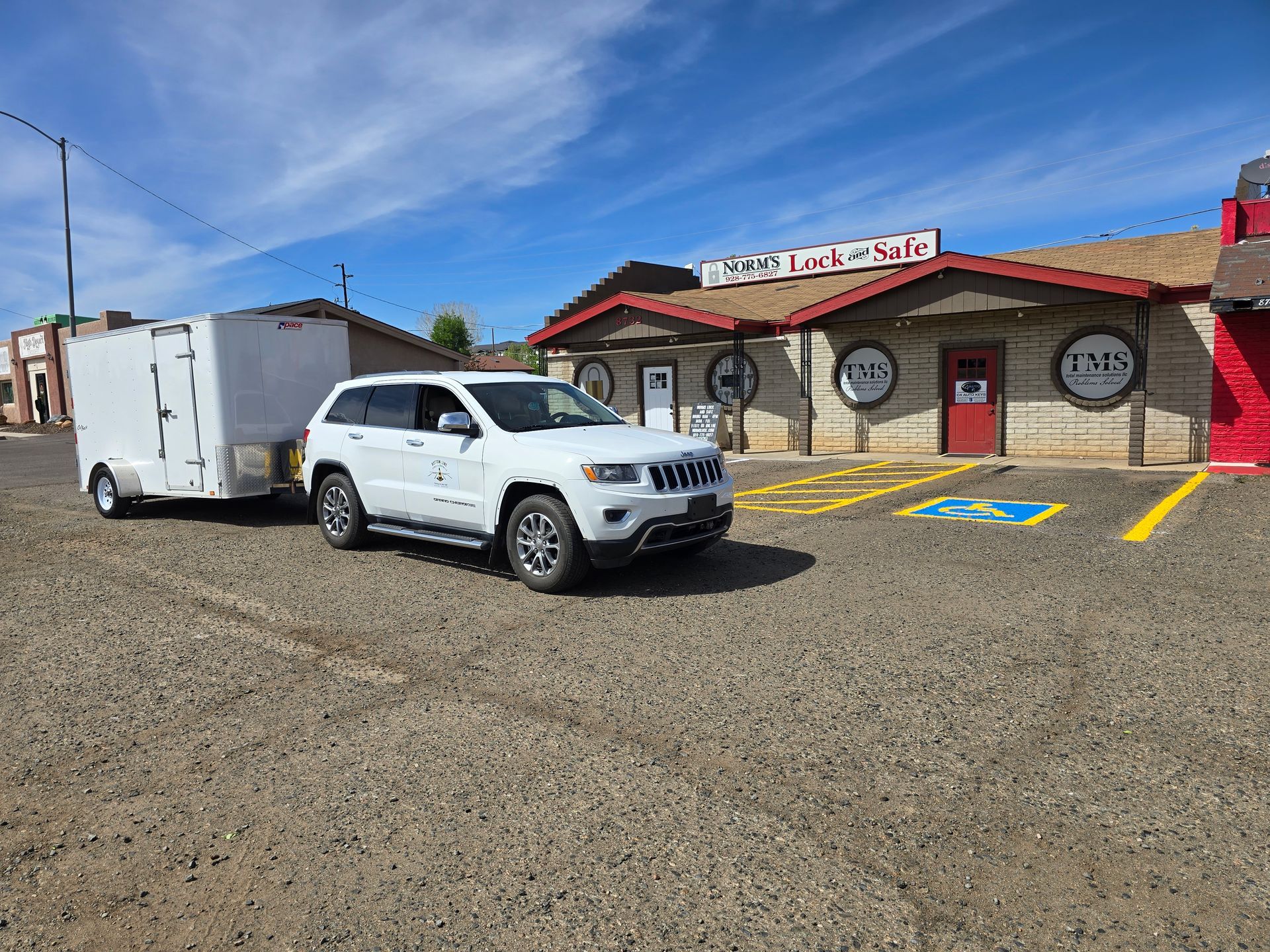 Yellow text painted on black asphalt reads