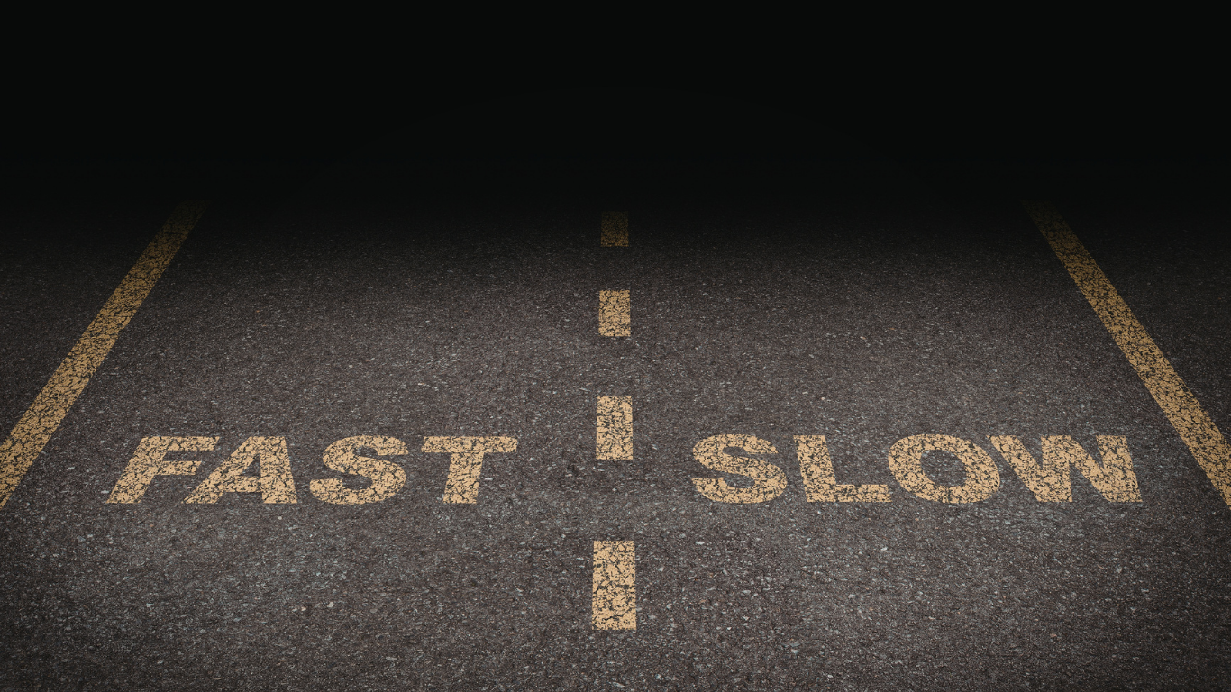 A paved road divided into two lanes, with the word