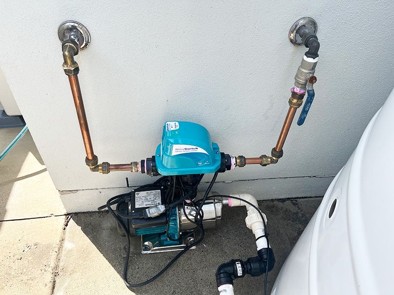 A Water Pump is Attached to a Wall — The Pump Doctor In Nambour, QLD