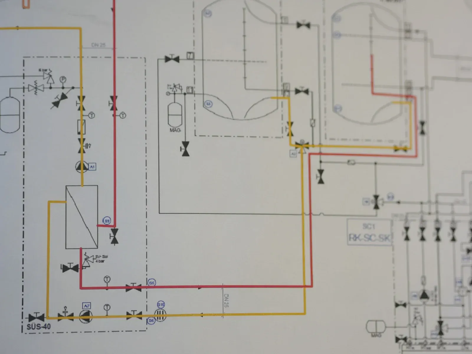 A close up of a drawing of a pipe system