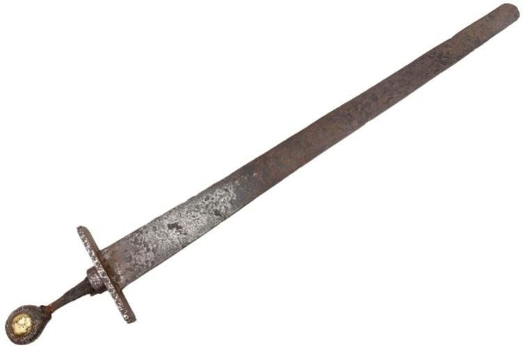 Rusty, medieval-looking sword with a straight blade and cross-shaped hilt.  The hilt ends with a round pommel.