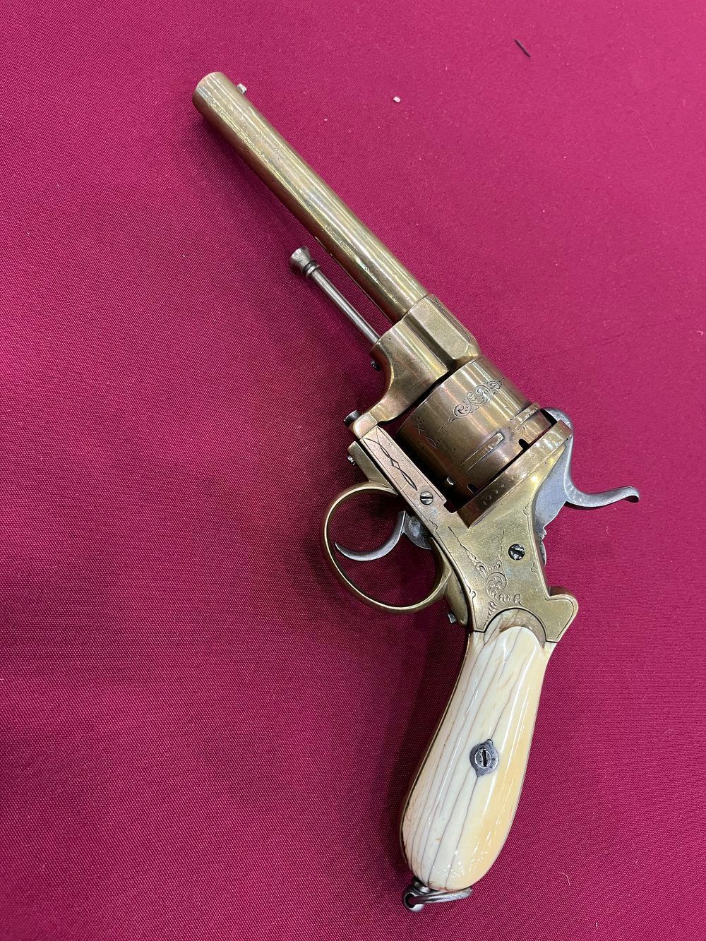 A close up of a revolver on a table.