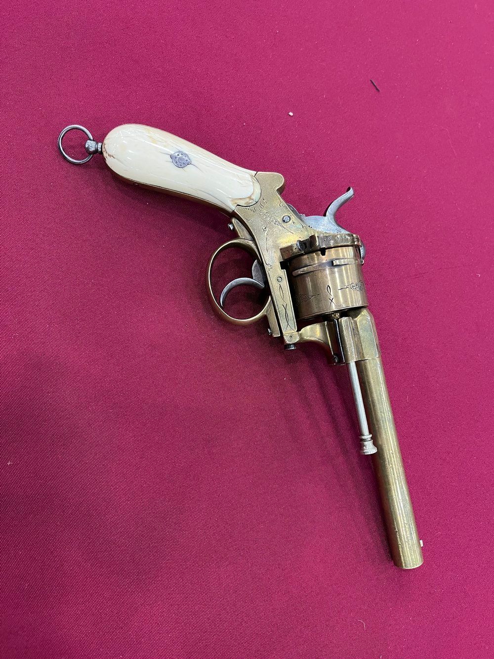 A close up of a revolver on a table.