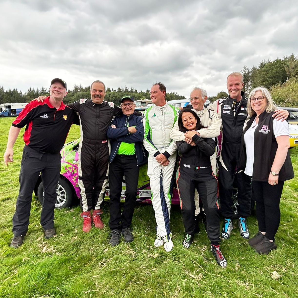 Andrew Dodds team smiling with famous rally drivers