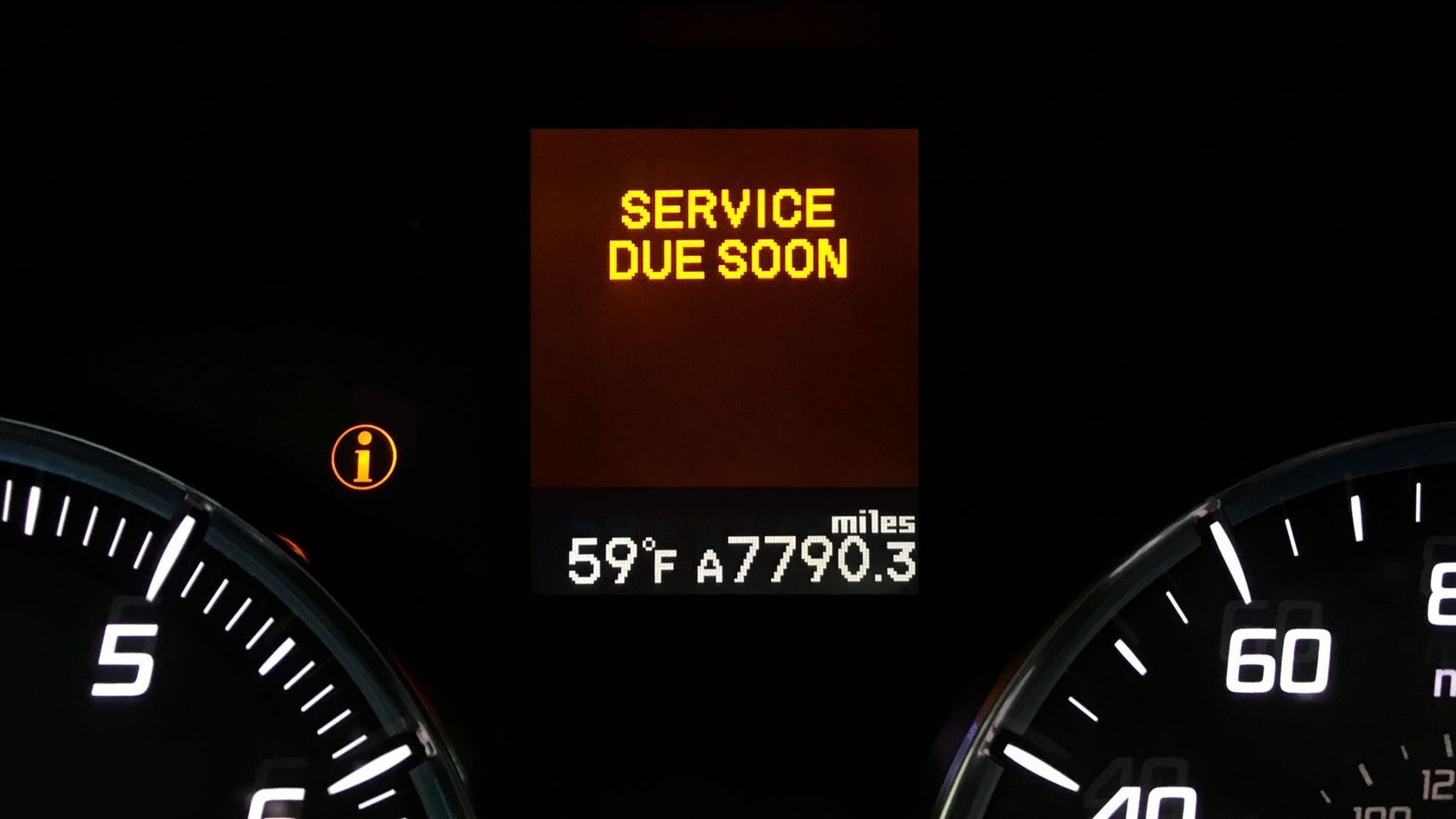 Car dashboard with a service due soon warning light