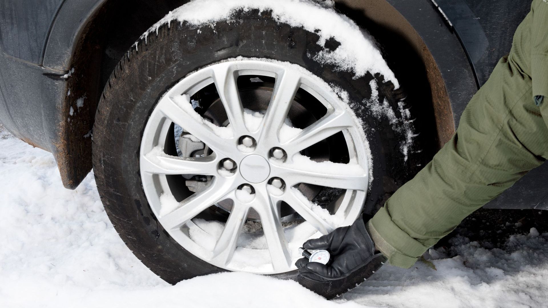 Close up of BMW car tyre in snow