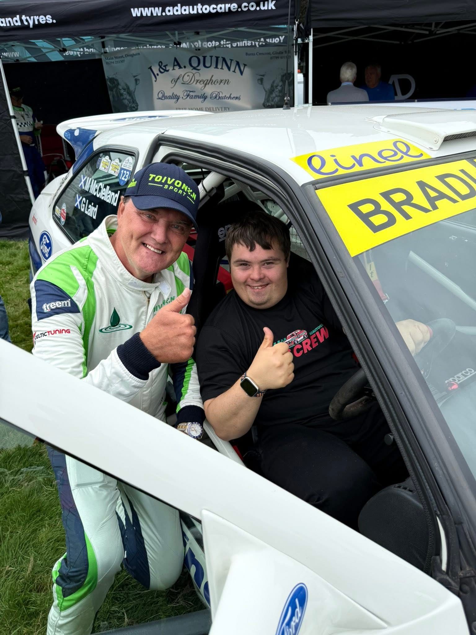 Toivonen smiling with a fan inside the racecar
