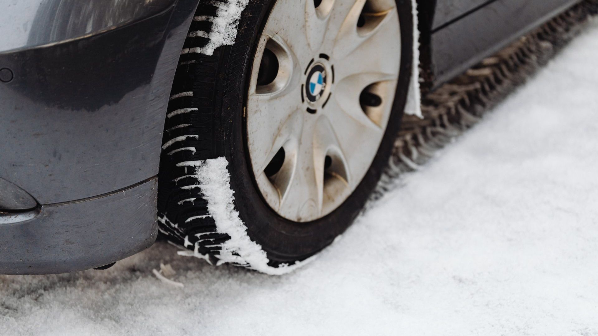 Close up of BMW car tyre in snow