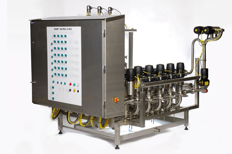 Stainless steel industrial processing unit with electrical panel and connected tubing.