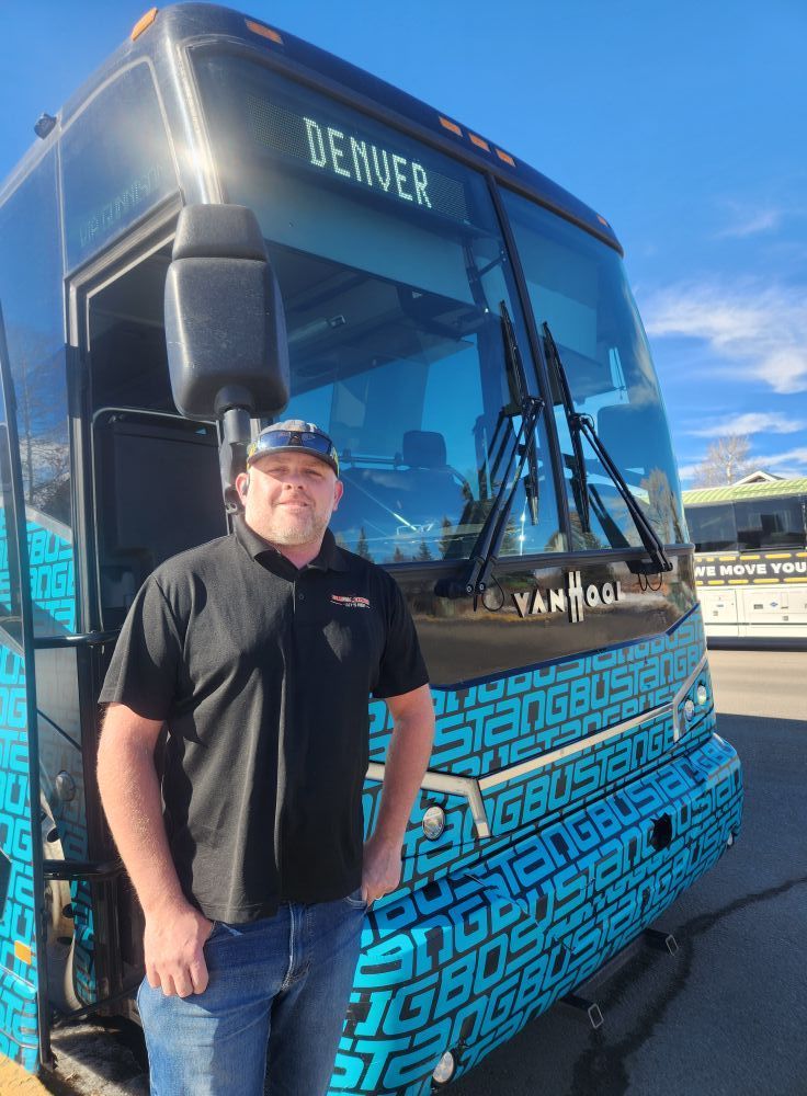 Man in front of bus with 