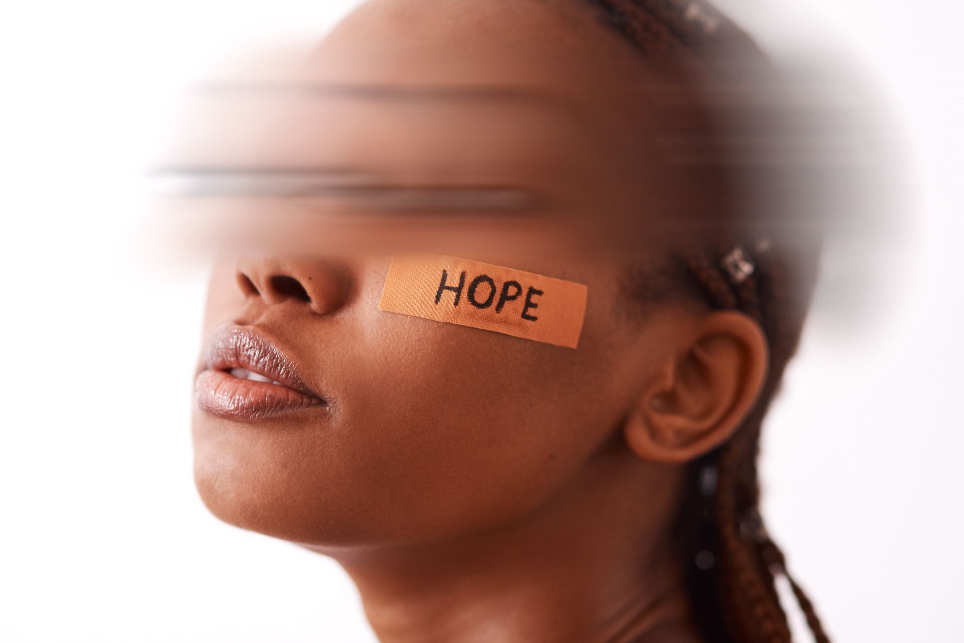 Woman crying, comforted by another, while a third person observes, likely in a therapy session.