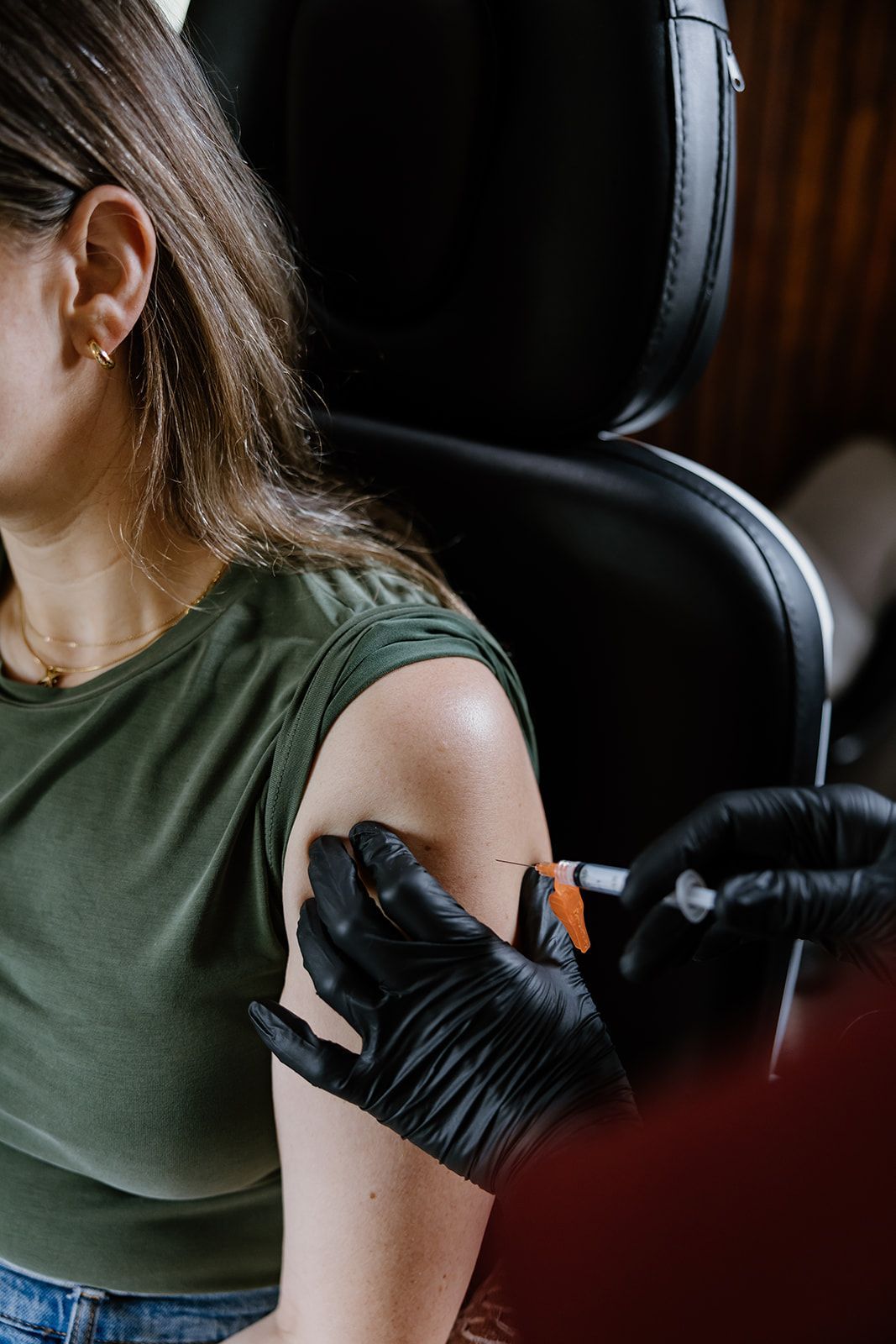 A woman is getting a blood drawn