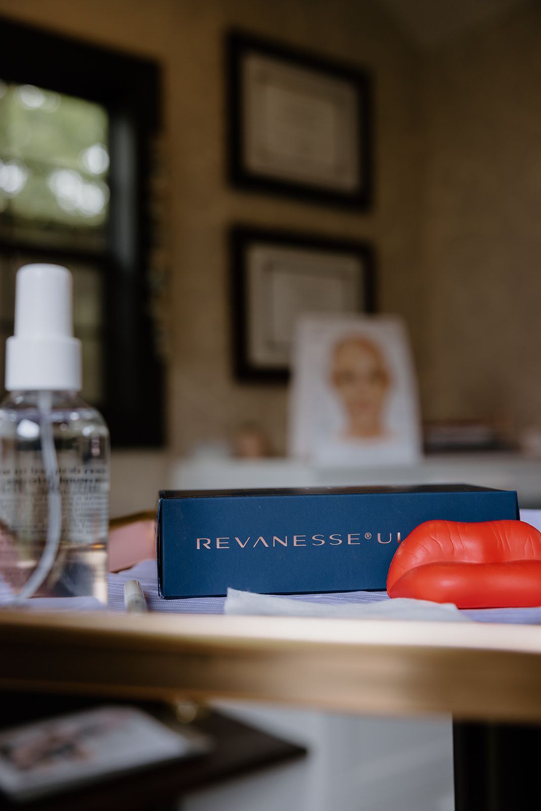 A table with a spray bottle and a box on it