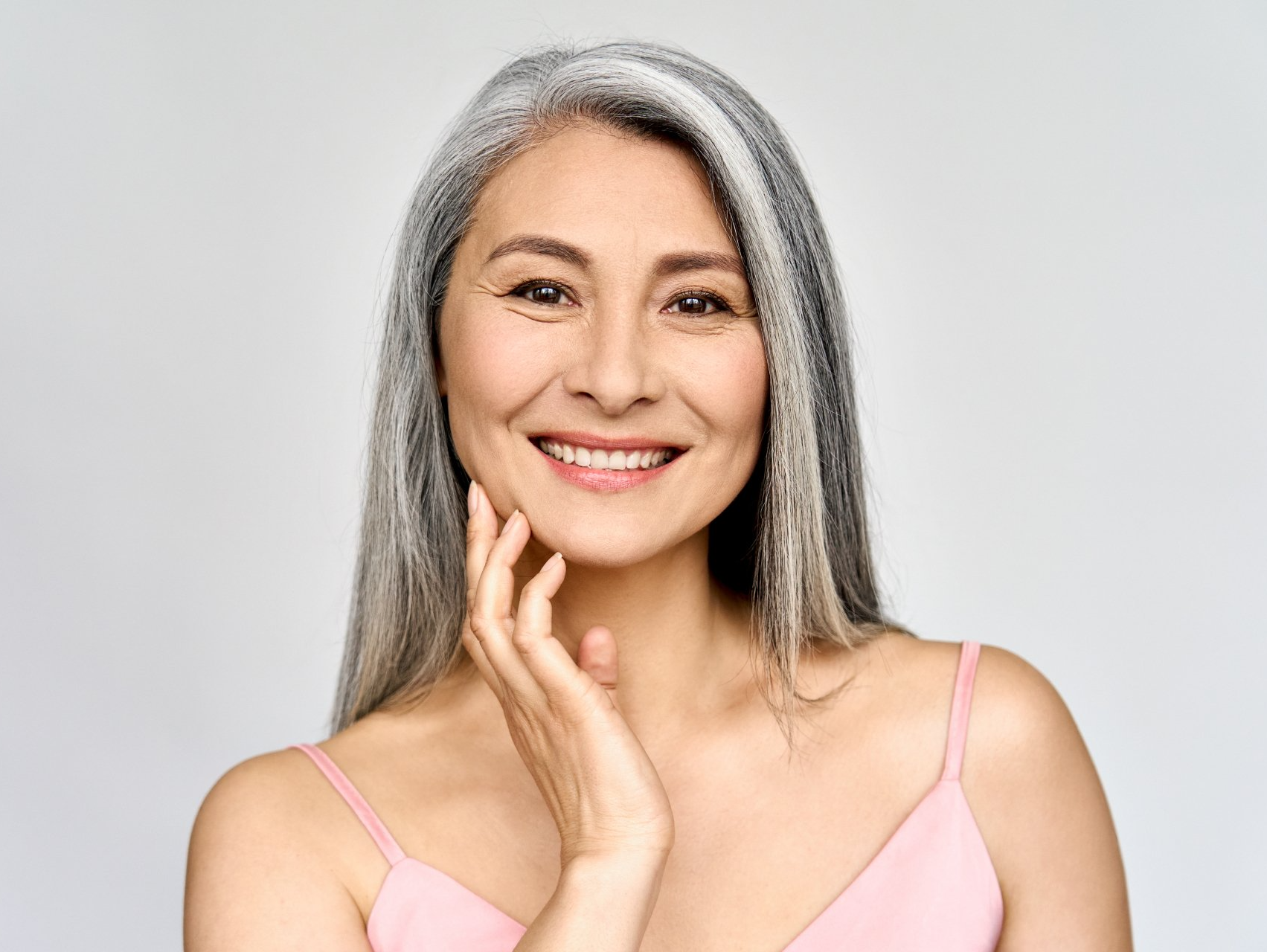 middle aged asian woman smiling