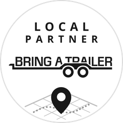 Local Partner logo for Bring a Trailer, with text, a trailer illustration, and a location pin.
