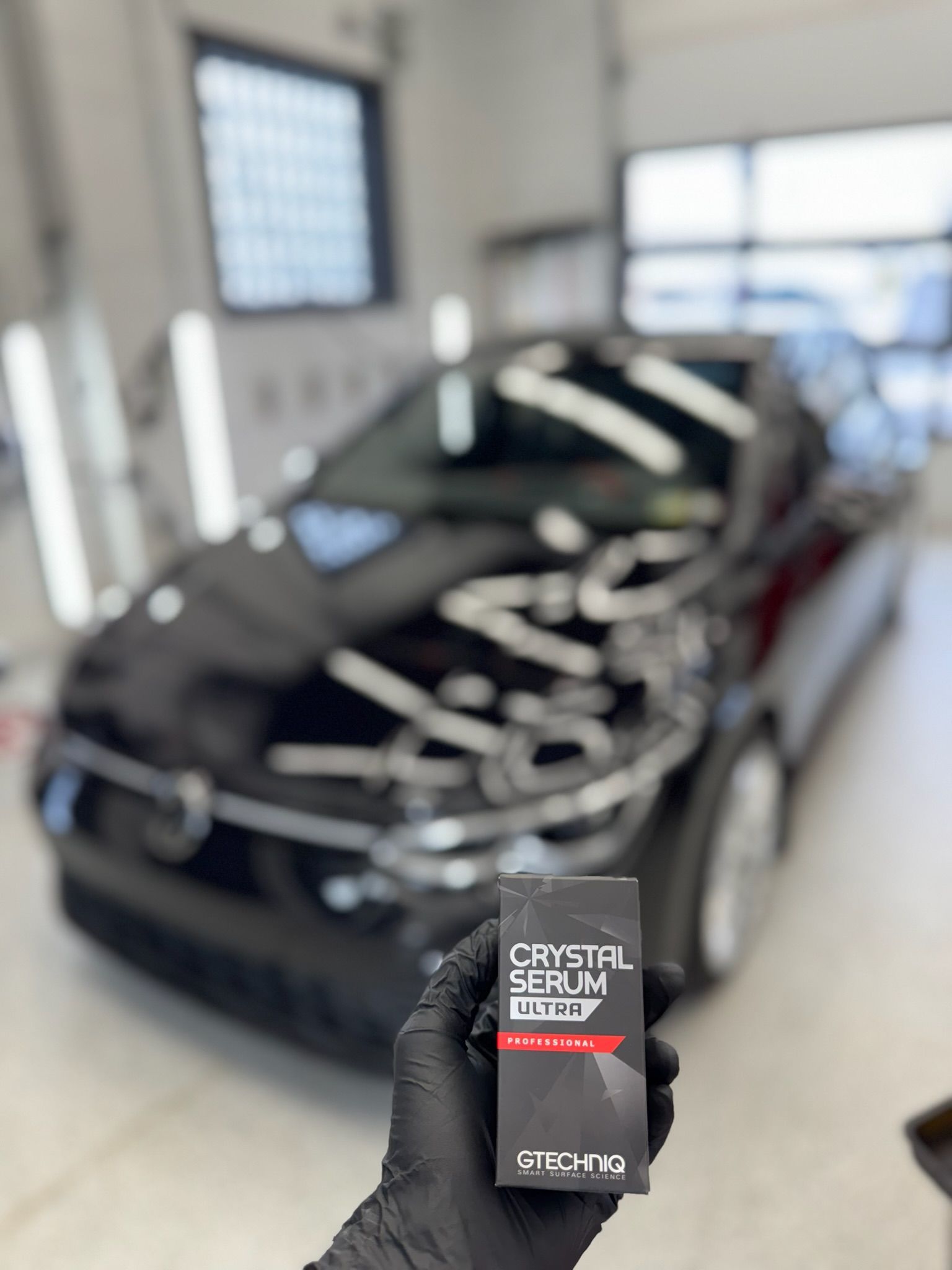 Person in black glove holding 