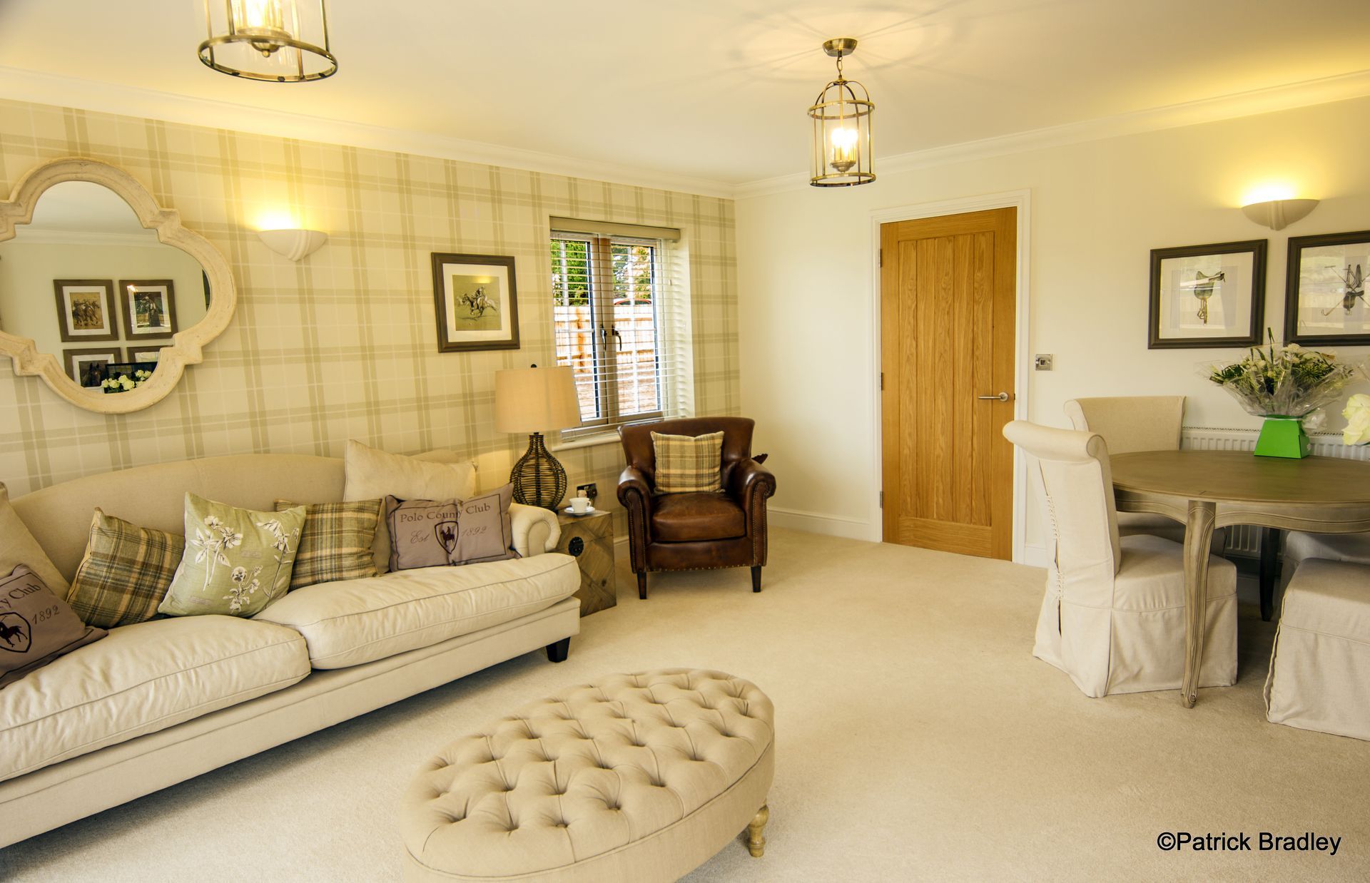 Limetree Village, A living room with a couch ottoman and chairs