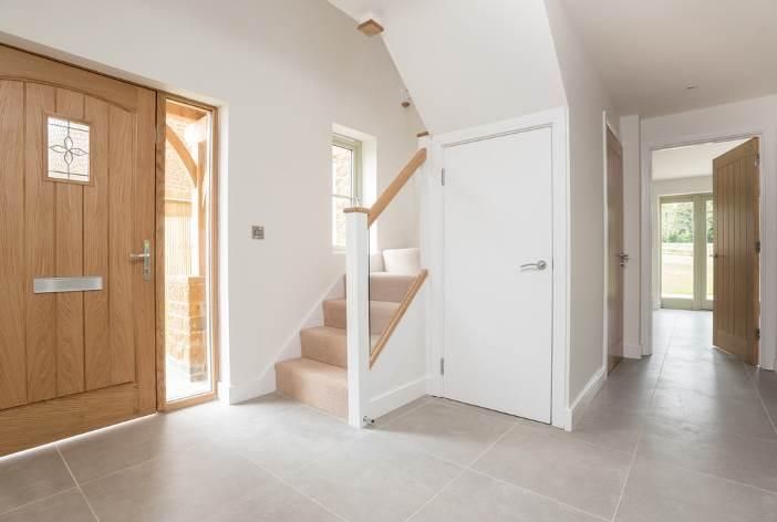 Brailes, A hallway with stairs leading up to the second floor of a house.