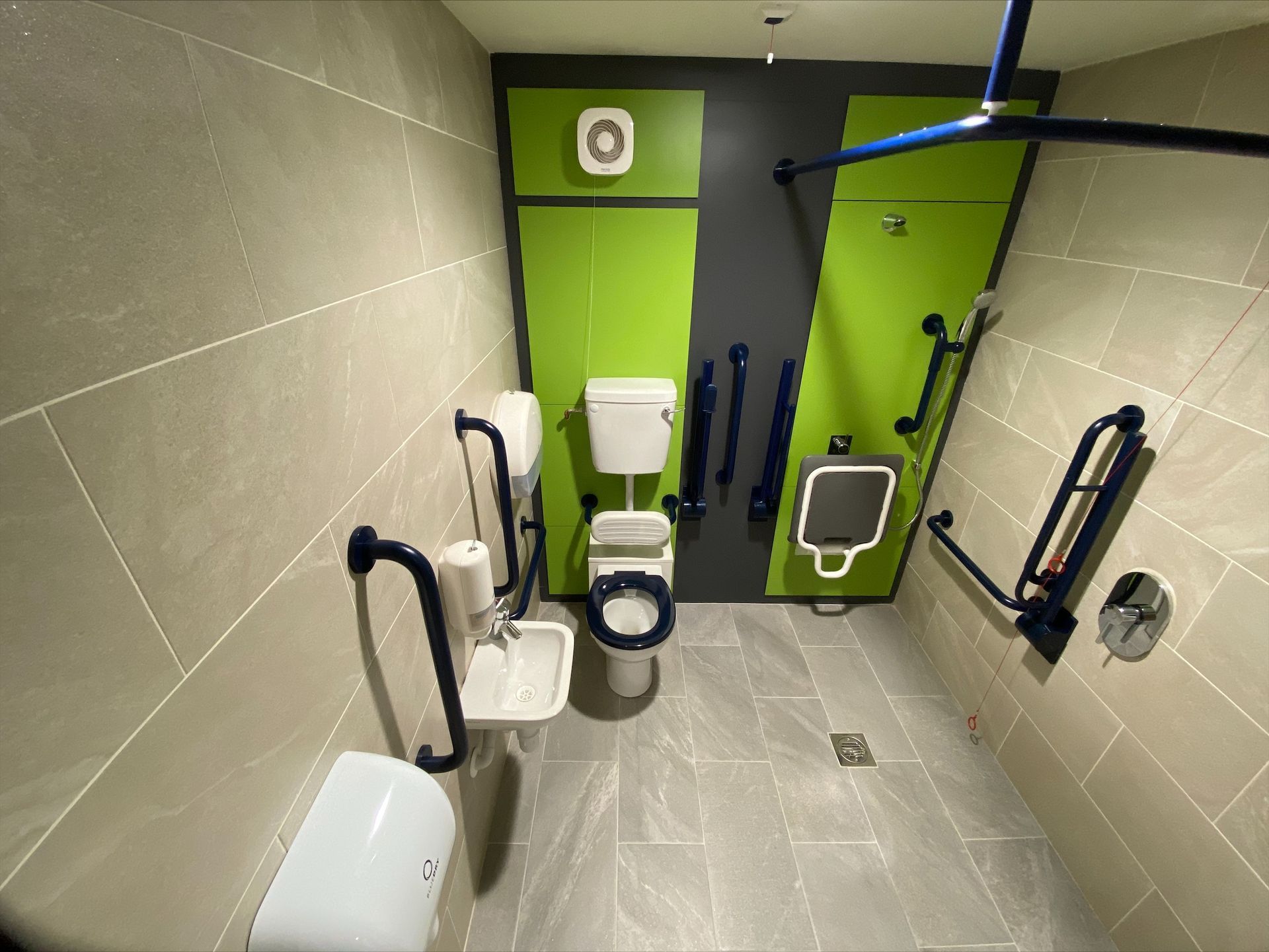 Gorcott Hill Park, A bathroom with a toilet , sink , and handrails.